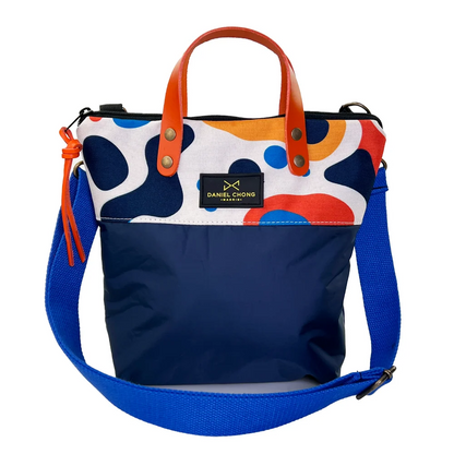 BANDOLERA MINI CON MANILLAS GRAPHIC EDITION
