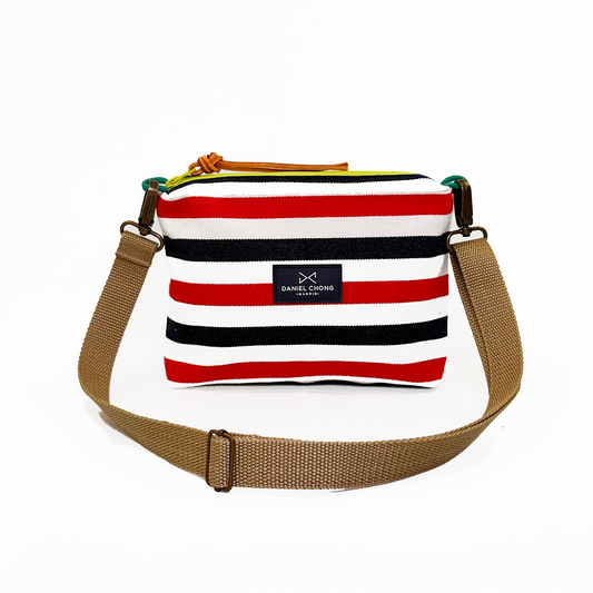 BANDOLERA MINI LONA RÚSTICA RAYAS ROJAS Y AZULES, ZIP VERDE FLÚOR